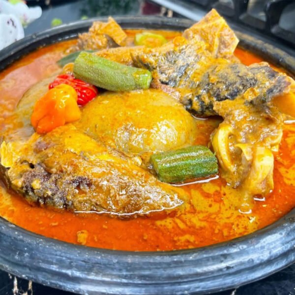 fufu with Abenkwan (palm nut soup)assorted meat and fish.