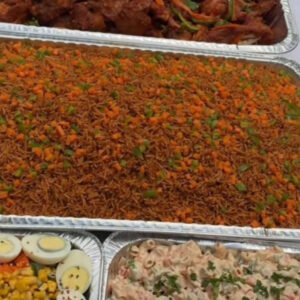 Vegetables jollof rice, with oven grilled turkey meat, pasta,  salad
