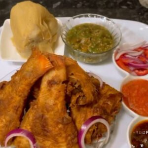 Ghana Ga kenkey with red fried fish with green pepper sauce, red pepper sauce, shito  OPTIONAL/with fried shrimps