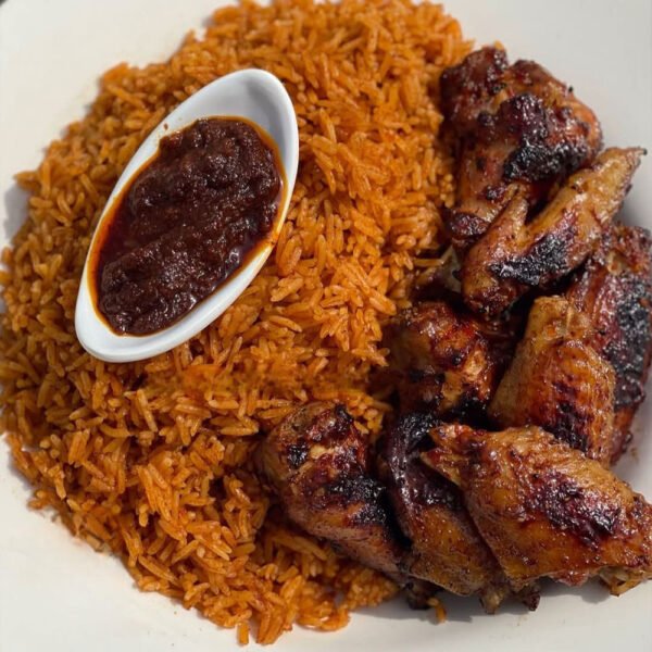 Jollof rice with grilled chicken wings or chicken drumsticks