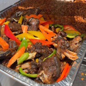 jollof rice with fried turkey meat and salad